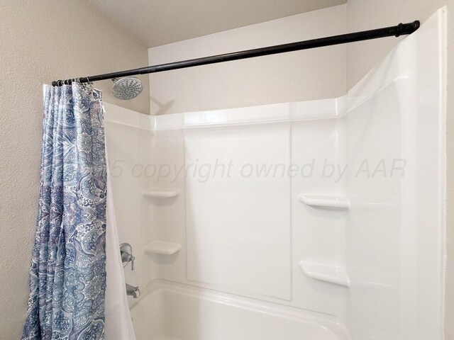 5012 Locker St, Amarillo, TX 79118 - full bath with shower / tub combo and a textured wall