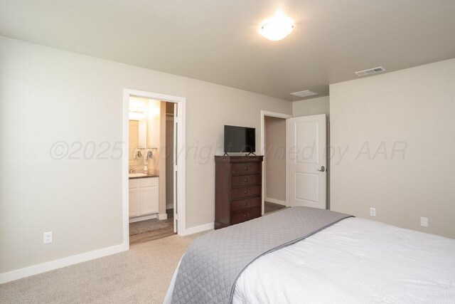 5012 Locker St, Amarillo, TX 79118 - bedroom with light carpet and connected bathroom