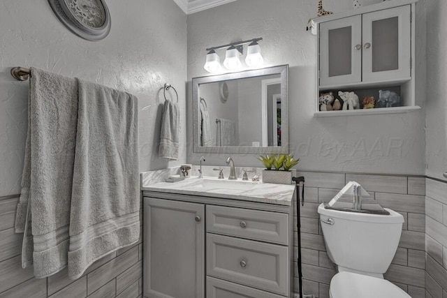 5105 Black Oak Dr, Amarillo, TX 79110 - half bathroom with vanity, a textured wall, and ornamental molding