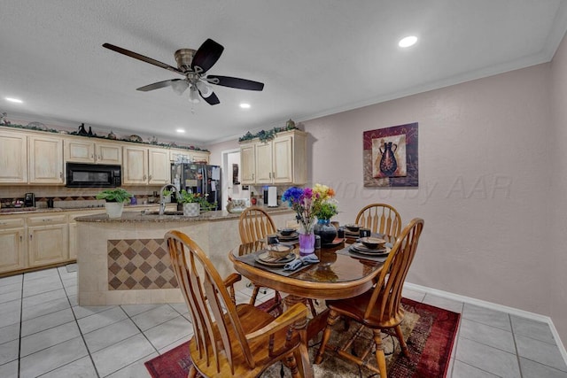 5105 Black Oak Dr, Amarillo, TX 79110 - dining room with light tile patterned floors, ceiling fan, crown molding, and recessed lighting