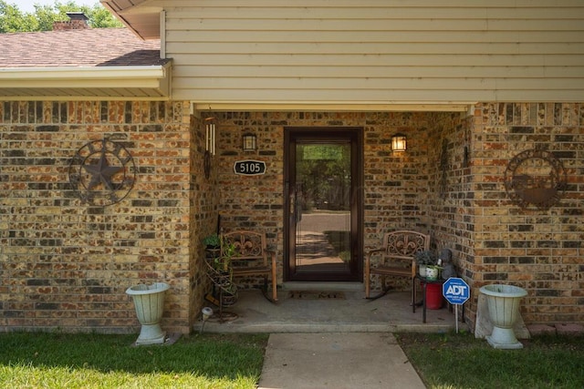 5105 Black Oak Dr, Amarillo, TX 79110 - property entrance featuring brick siding and roof with shingles