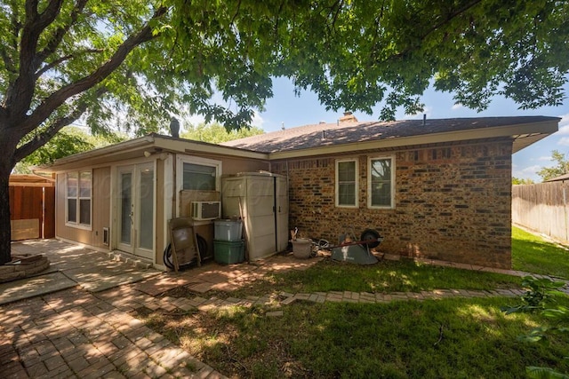 5105 Black Oak Dr, Amarillo, TX 79110 - back of property featuring a patio area, brick siding, a chimney, and cooling unit