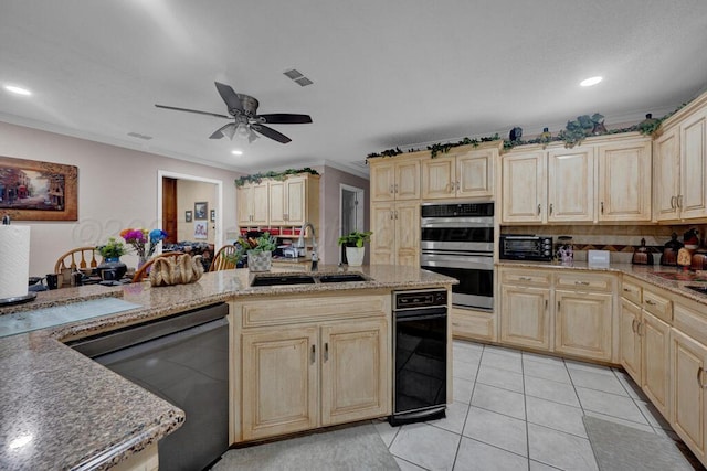 5105 Black Oak Dr, Amarillo, TX 79110 - kitchen featuring dishwashing machine, double oven, light brown cabinetry, light tile patterned floors, and light stone counters