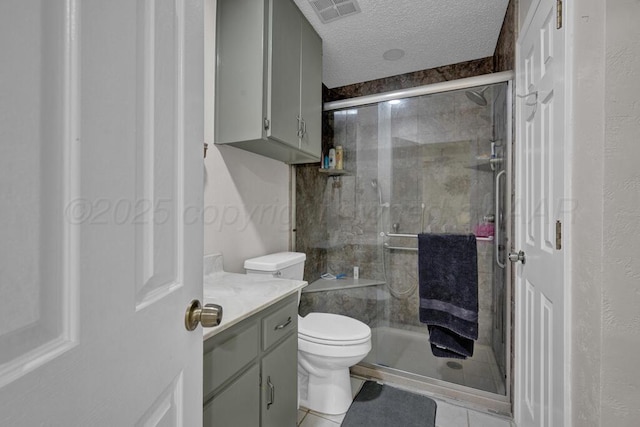 5105 Black Oak Dr, Amarillo, TX 79110 - full bathroom with a stall shower, vanity, a textured ceiling, and tile patterned flooring