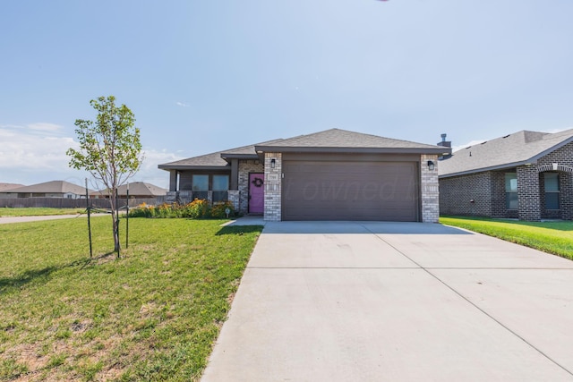 7701 Bellamy Dr, Amarillo, TX 79119 - ranch-style house featuring a front yard, an attached garage, driveway, and brick siding