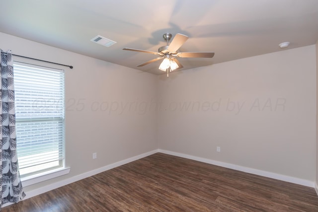 7701 Bellamy Dr, Amarillo, TX 79119 - unfurnished room with a ceiling fan, healthy amount of natural light, and dark wood-style flooring