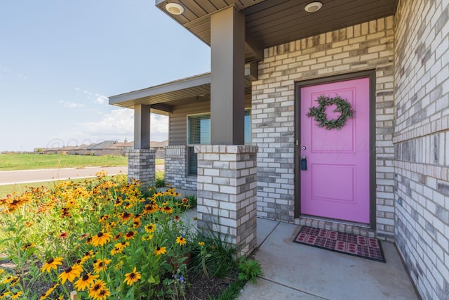 7701 Bellamy Dr, Amarillo, TX 79119 - property entrance with a porch and brick siding