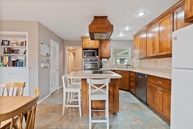 3607 Fleetwood Dr, Amarillo, TX 79109 - kitchen with appliances with stainless steel finishes, stone finish floors, backsplash, a kitchen bar, and recessed lighting