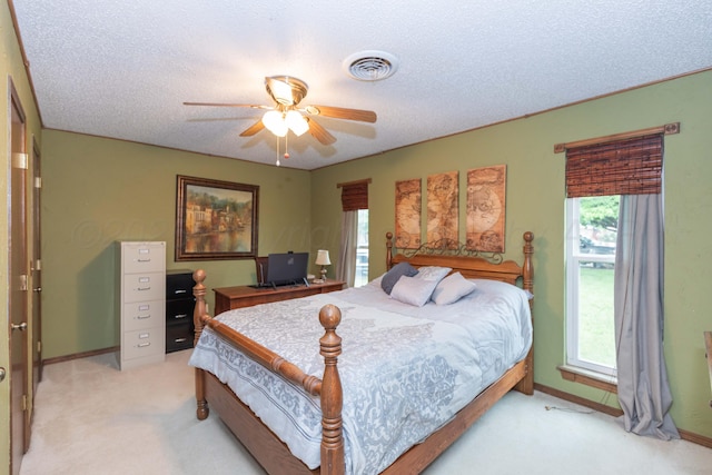 7806 Cervin Dr, Amarillo, TX 79121 - bedroom with light carpet, baseboards, ceiling fan, and a textured ceiling