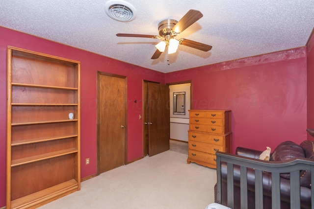 7806 Cervin Dr, Amarillo, TX 79121 - carpeted bedroom with two closets, a textured ceiling, and a ceiling fan