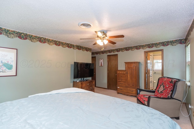 7806 Cervin Dr, Amarillo, TX 79121 - bedroom featuring a textured ceiling, light carpet, and a ceiling fan