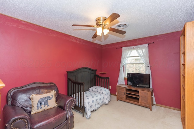 7806 Cervin Dr, Amarillo, TX 79121 - bedroom featuring carpet floors, ceiling fan, and a textured ceiling
