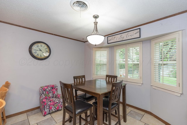 7806 Cervin Dr, Amarillo, TX 79121 - dining room with ornamental molding, baseboards, a textured ceiling, and light tile patterned flooring