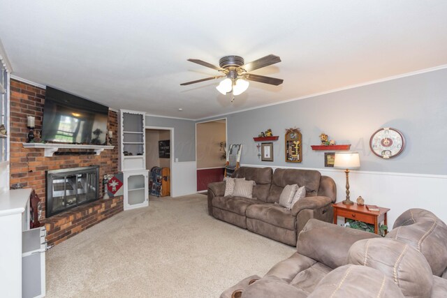 407 Thompson Ln, Canyon, TX 79015 - living room featuring crown molding, ceiling fan, carpet flooring, and a brick fireplace