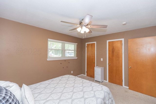 407 Thompson Ln, Canyon, TX 79015 - carpeted bedroom with ceiling fan and multiple closets