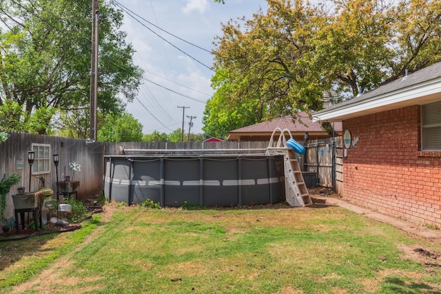 407 Thompson Ln, Canyon, TX 79015 - view of yard with an outdoor pool and a fenced backyard