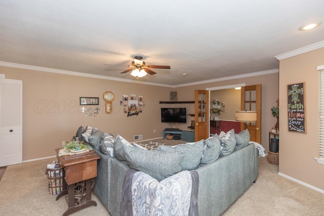 407 Thompson Ln, Canyon, TX 79015 - living room with a ceiling fan, baseboards, visible vents, crown molding, and light carpet