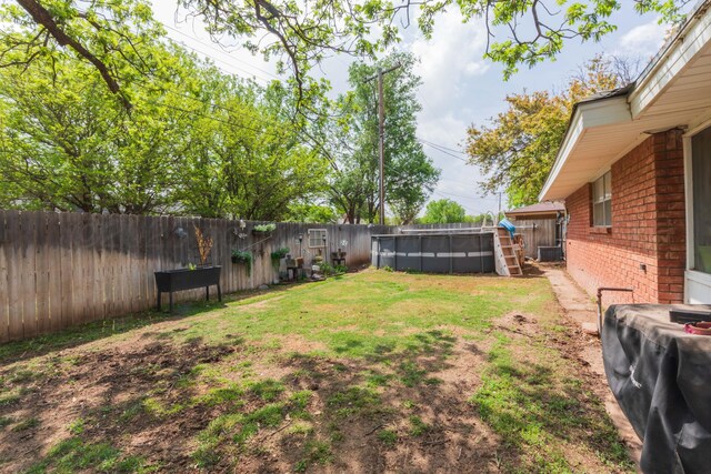 407 Thompson Ln, Canyon, TX 79015 - view of yard featuring central AC unit, a fenced in pool, and a fenced backyard