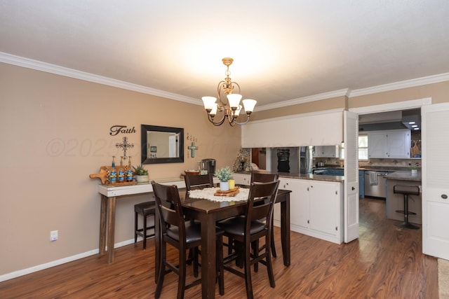 407 Thompson Ln, Canyon, TX 79015 - dining area with dark wood-style flooring, ornamental molding, and an inviting chandelier