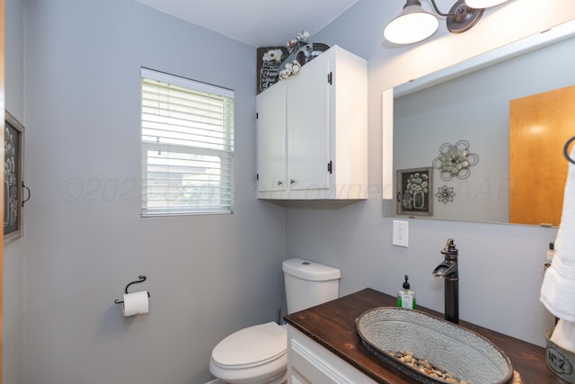 407 Thompson Ln, Canyon, TX 79015 - bathroom with vanity, toilet, and wood finished floors