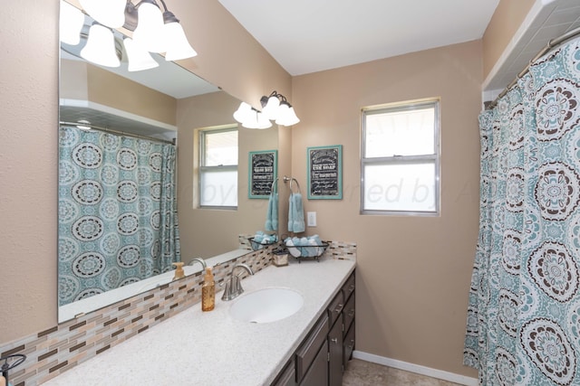 407 Thompson Ln, Canyon, TX 79015 - bathroom with vanity, a healthy amount of sunlight, a chandelier, and curtained shower
