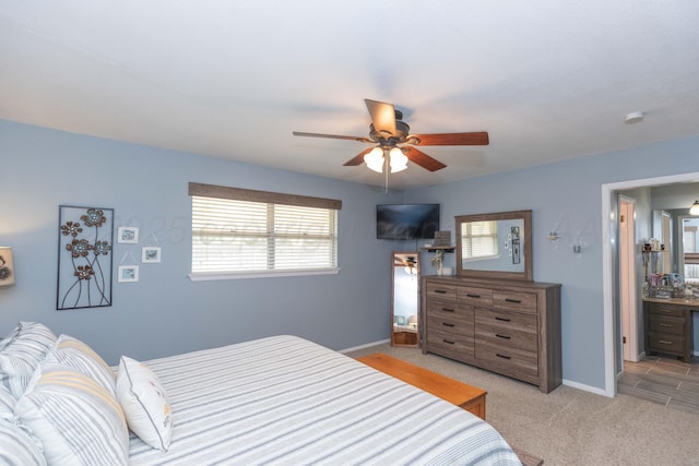 407 Thompson Ln, Canyon, TX 79015 - bedroom featuring multiple windows, light carpet, and baseboards