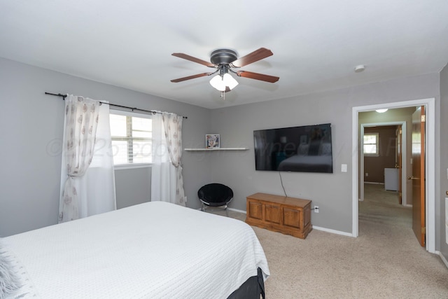 407 Thompson Ln, Canyon, TX 79015 - carpeted bedroom featuring multiple windows, baseboards, and ceiling fan