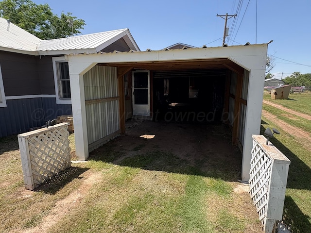 605 E 4th St, Panhandle, TX 79068 - view of outdoor structure featuring driveway and a carport