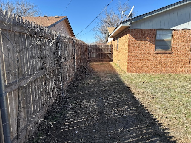 view of side of property with a yard