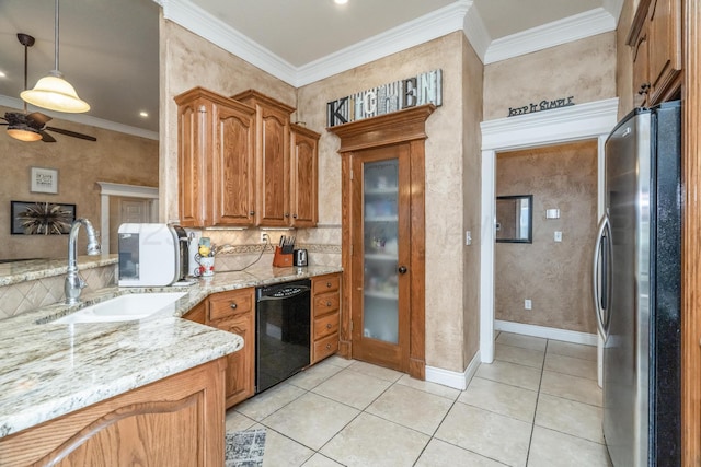 212 Cimarron St, Borger, TX 79007 - kitchen featuring black dishwasher, freestanding refrigerator, a sink, tasteful backsplash, and light stone countertops