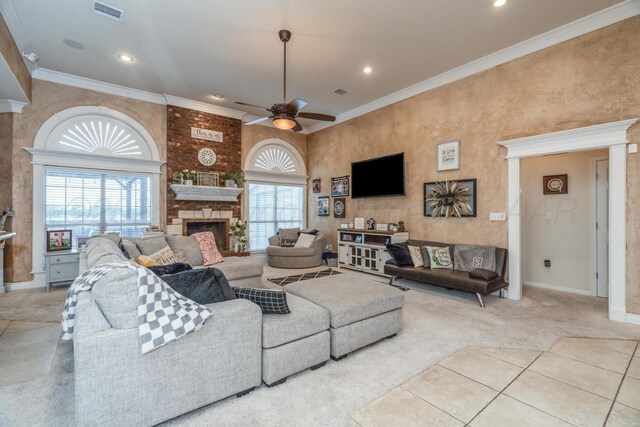 212 Cimarron St, Borger, TX 79007 - carpeted living room featuring a stone fireplace, a ceiling fan, baseboards, recessed lighting, and crown molding