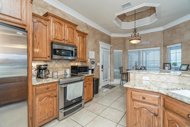 212 Cimarron St, Borger, TX 79007 - kitchen featuring appliances with stainless steel finishes, light tile patterned flooring, backsplash, brown cabinetry, and crown molding