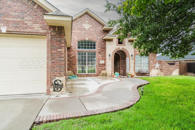 212 Cimarron St, Borger, TX 79007 - entrance to property with brick siding and a garage
