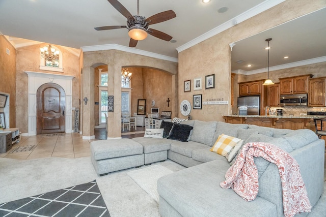 212 Cimarron St, Borger, TX 79007 - living area with arched walkways, a chandelier, ornamental molding, a ceiling fan, and light colored carpet