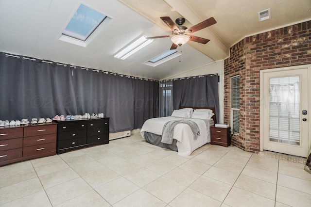 212 Cimarron St, Borger, TX 79007 - bedroom with brick wall, lofted ceiling, a skylight, light tile patterned floors, and a ceiling fan