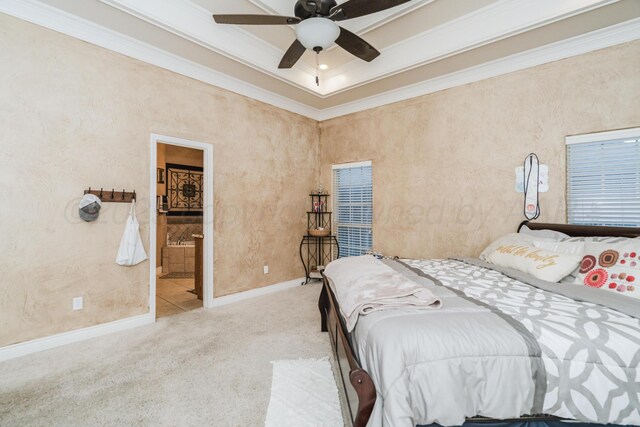 212 Cimarron St, Borger, TX 79007 - bedroom featuring crown molding, carpet, a ceiling fan, connected bathroom, and baseboards