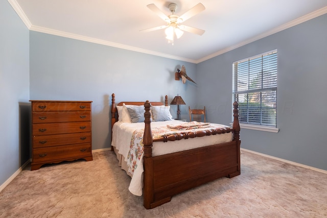 bedroom with crown molding, baseboards, and carpet floors