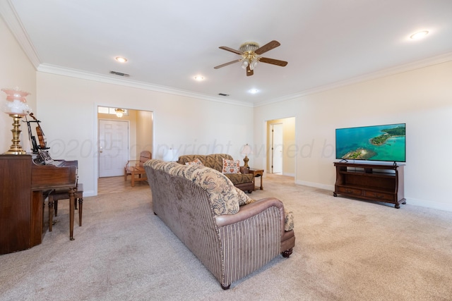 living area with visible vents, crown molding, baseboards, light colored carpet, and ceiling fan