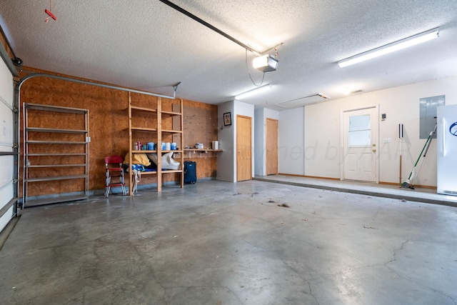 garage with electric panel and a garage door opener