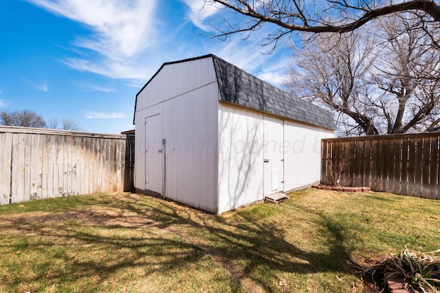 view of shed with a fenced backyard