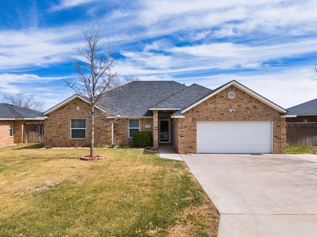 ranch-style house with brick siding, a front lawn, fence, driveway, and an attached garage