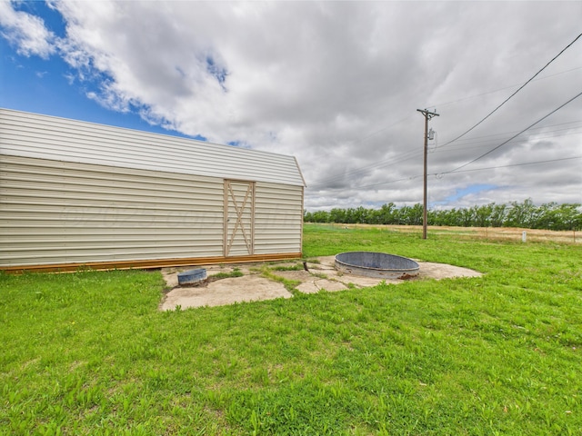 1108 Campanella Dr, Pampa, TX 79065 - view of green lawn with a fire pit