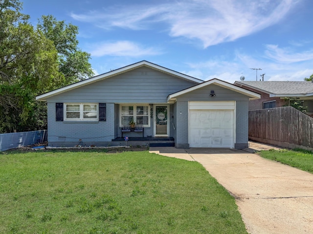 424 Santa Fe St, Borger, TX 79007 - view of front of home with brick siding, an attached garage, concrete driveway, and covered porch