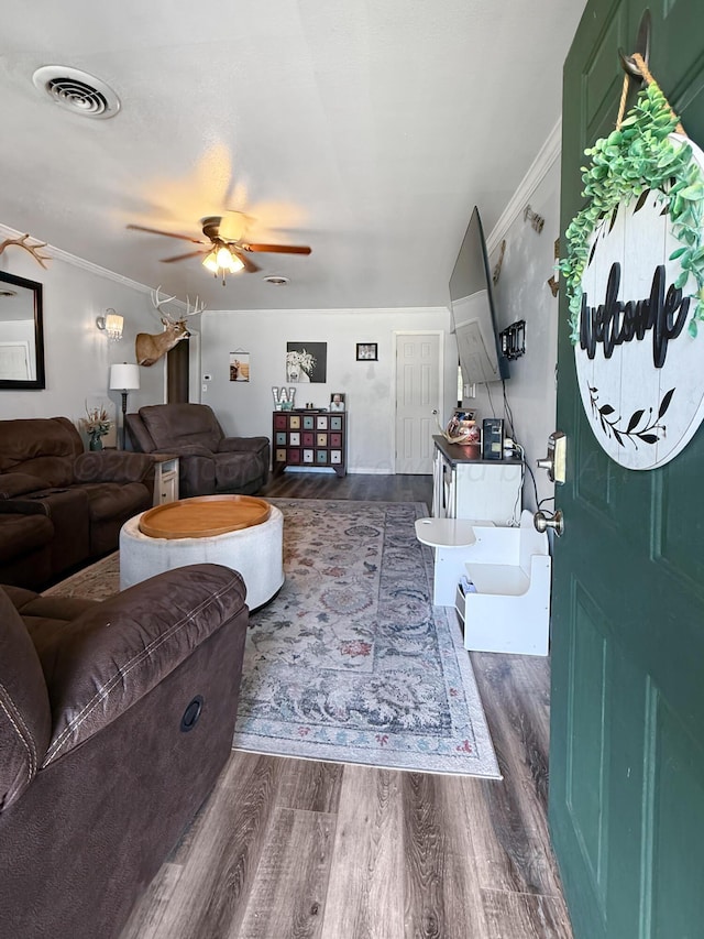 424 Santa Fe St, Borger, TX 79007 - living area featuring wood finished floors, ceiling fan, and crown molding
