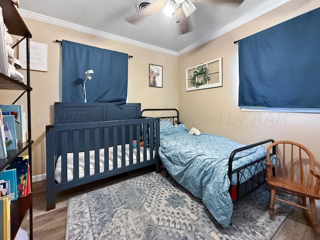 424 Santa Fe St, Borger, TX 79007 - bedroom featuring wood finished floors, ornamental molding, baseboards, and ceiling fan