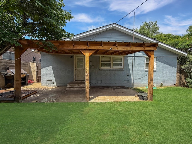 424 Santa Fe St, Borger, TX 79007 - rear view of property with brick siding, a patio, and crawl space