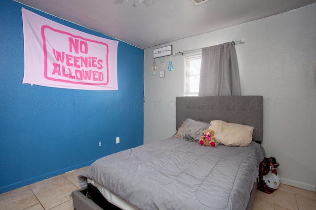 bedroom featuring light tile patterned flooring