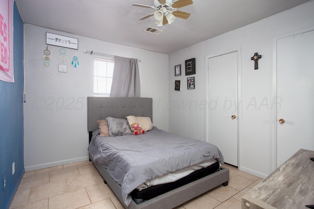 bedroom featuring ceiling fan and light tile patterned floors