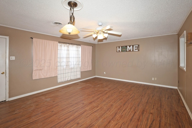 empty room with a textured ceiling, ceiling fan, and dark hardwood / wood-style floors