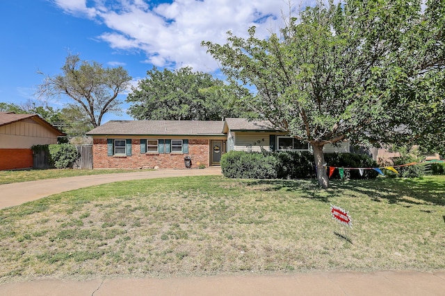 ranch-style home with a front yard